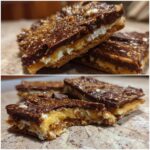 Close-up of layered churro saltine toffee bars showing a cracker base, caramel, marshmallow, and chocolate topping dusted with cinnamon sugar.